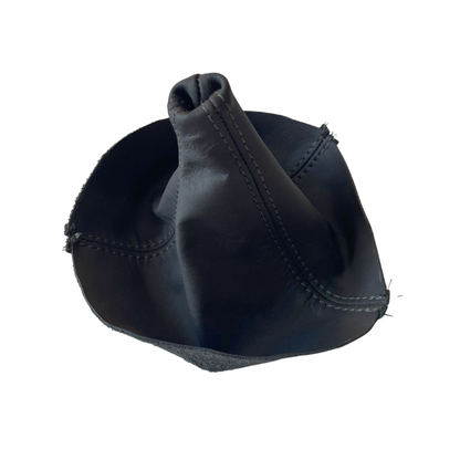 A black leather gear shift boot cover with visible stitching