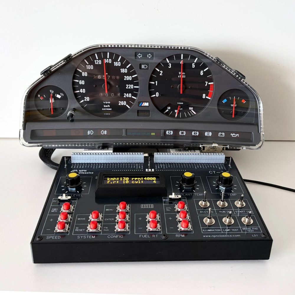 A custom-built BMW E30 instrument cluster and dashboard control console assembly.